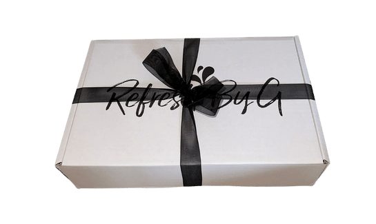 Refresh By G gift box wrapped in black ribbon with a bow