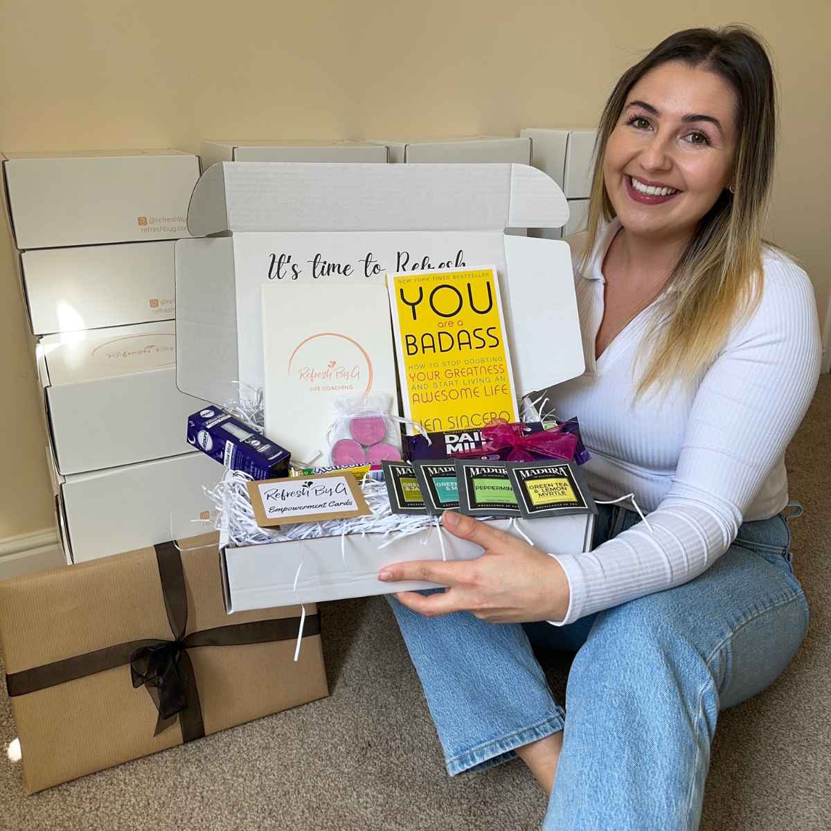 Refresh By G founder Georgina McGarry in the early days of her business holding her original 'Confidence Builder' Gift Box