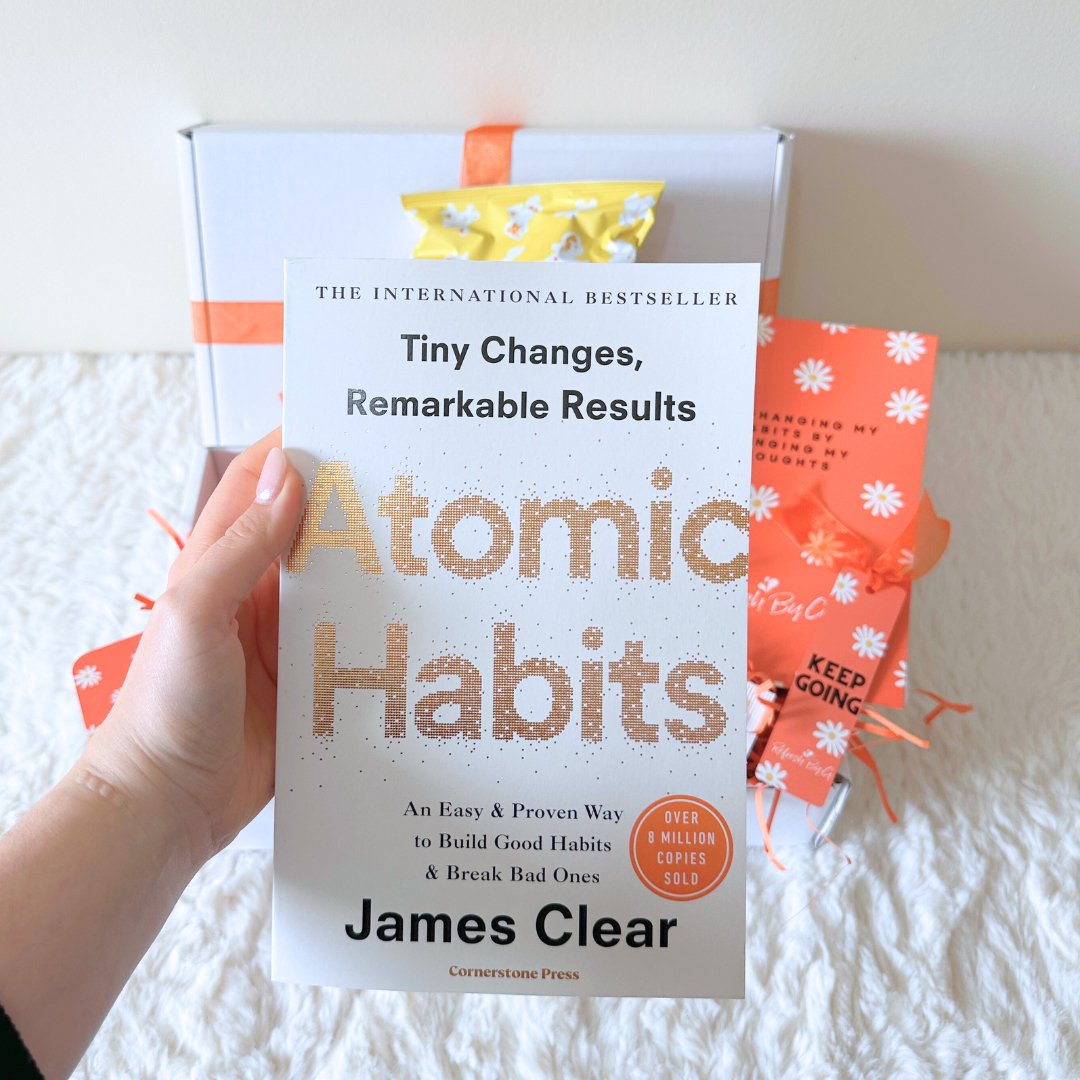 Paperback copy of Atomic Habits by James Clear which is included in the Refresh By G Positive Habits Gift Box