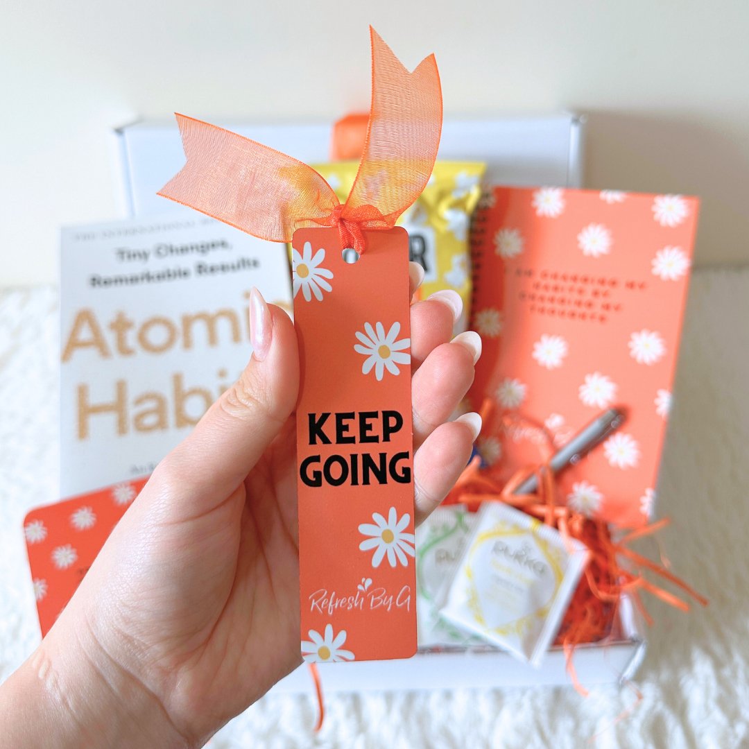 Red bookmark with ribbon and the quote &